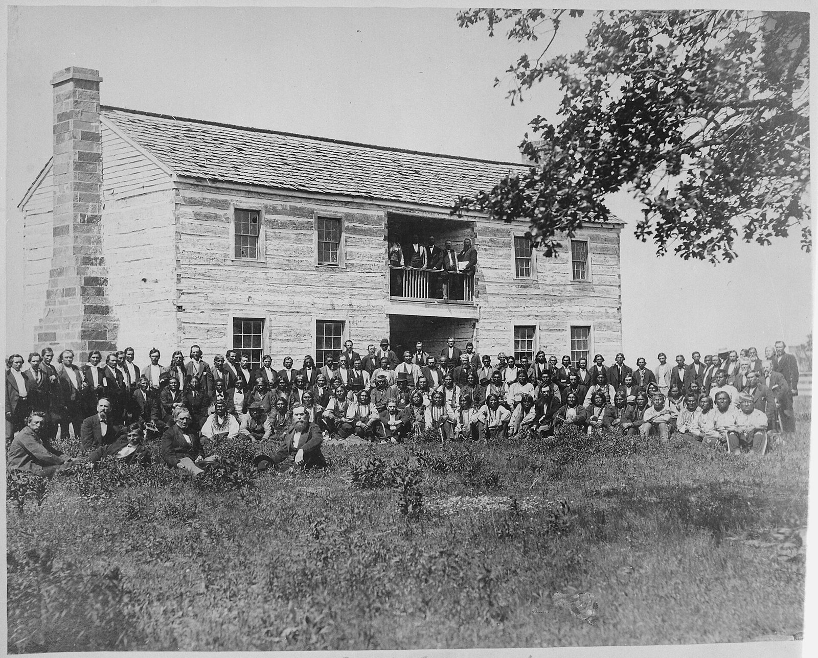 Delegates from 34 tribes in front of the Creek Council House, Indian Territory, 1880