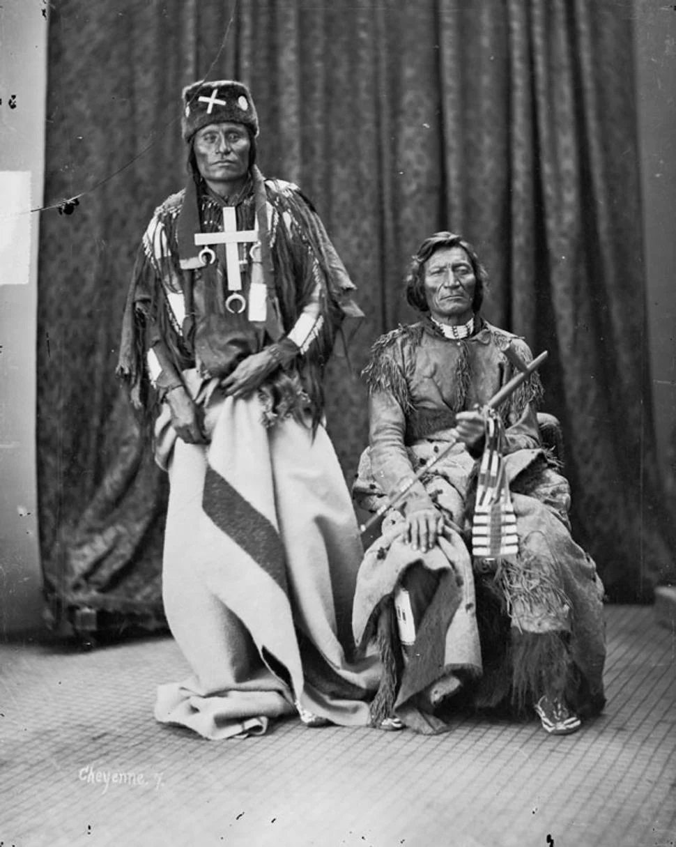 Little Wolf (standing) and Dull Knife (seated), the Northern Cheyenne chiefs who led their people's escape north in 1878