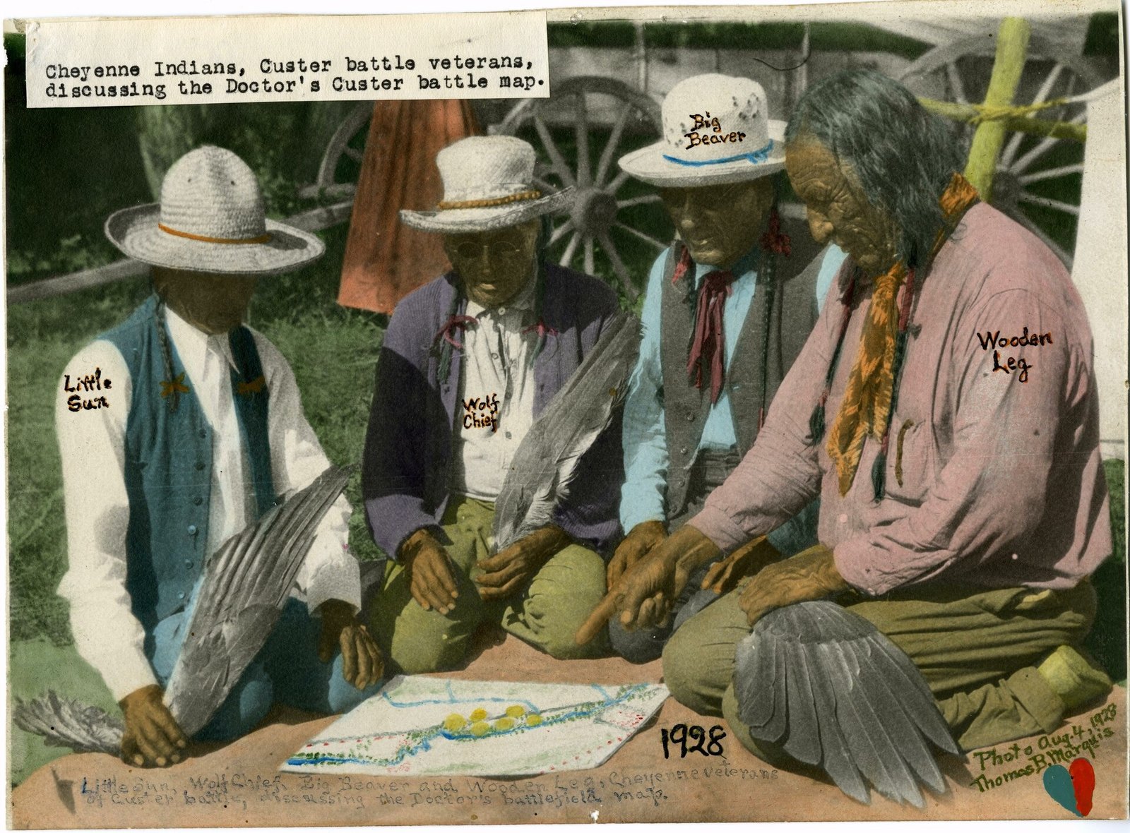 Cheyenne veterans of the battle (Little Sun, Wolf Chief, Big Beaver and Wooden Leg) study a map of the battlefield in th